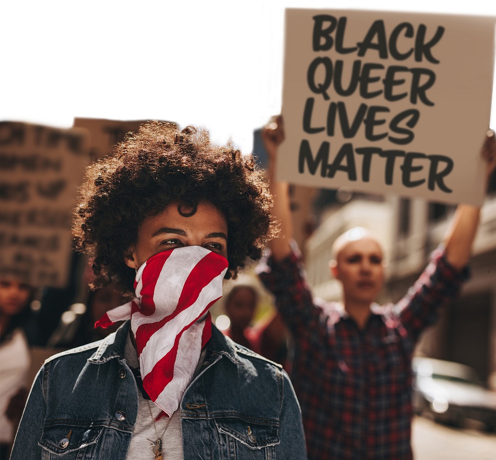 protestors holding sign that black queer lives matter