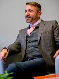 photo of perry halkitis seated in a listening pose