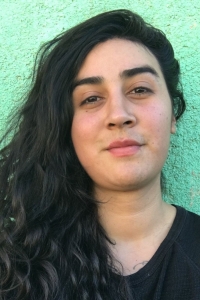 Photo of Esperanza Santos in front of a green background